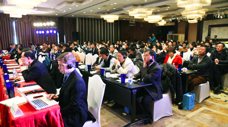 Attendees at the new gTLDs event in Beijing listen attentively, many through the aid of headphones carrying interpretation in their languages.