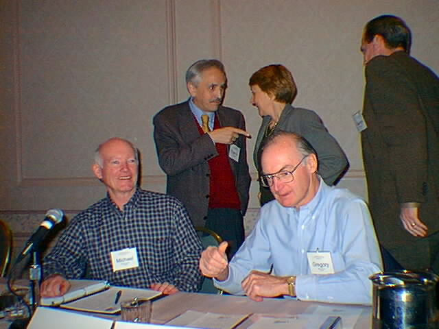 1998 - Greg Crew makes a point with an audience member as Michael Roberts smiles; Eugenio Triana of Spain points a finger at Esther Dyson as George Conradis looks on. Source: http://www.tftb.com/